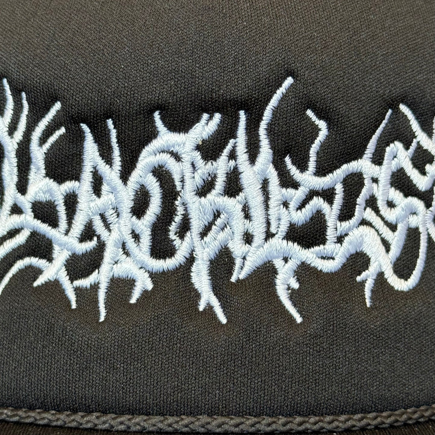 ENTANGLEMENT TRUCKER CAP
