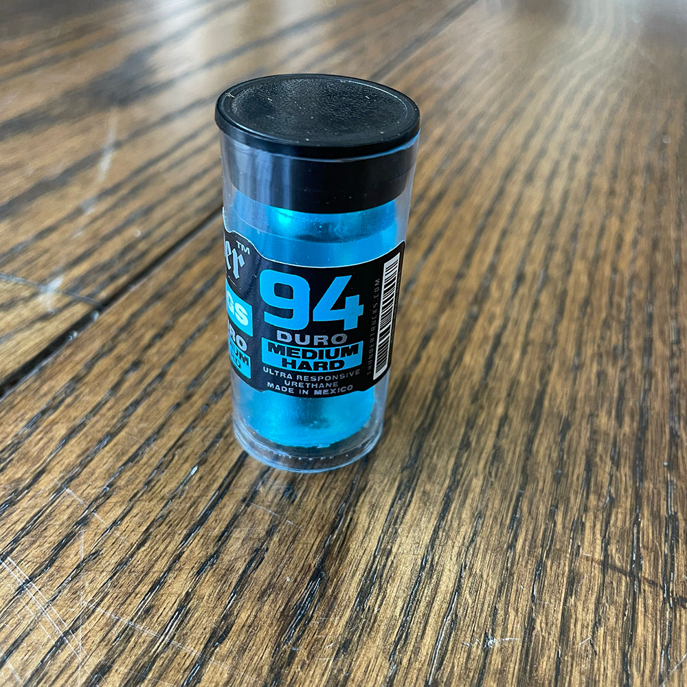 Thunder bushing in clear tube with black cap and blue 94 DU Medium label